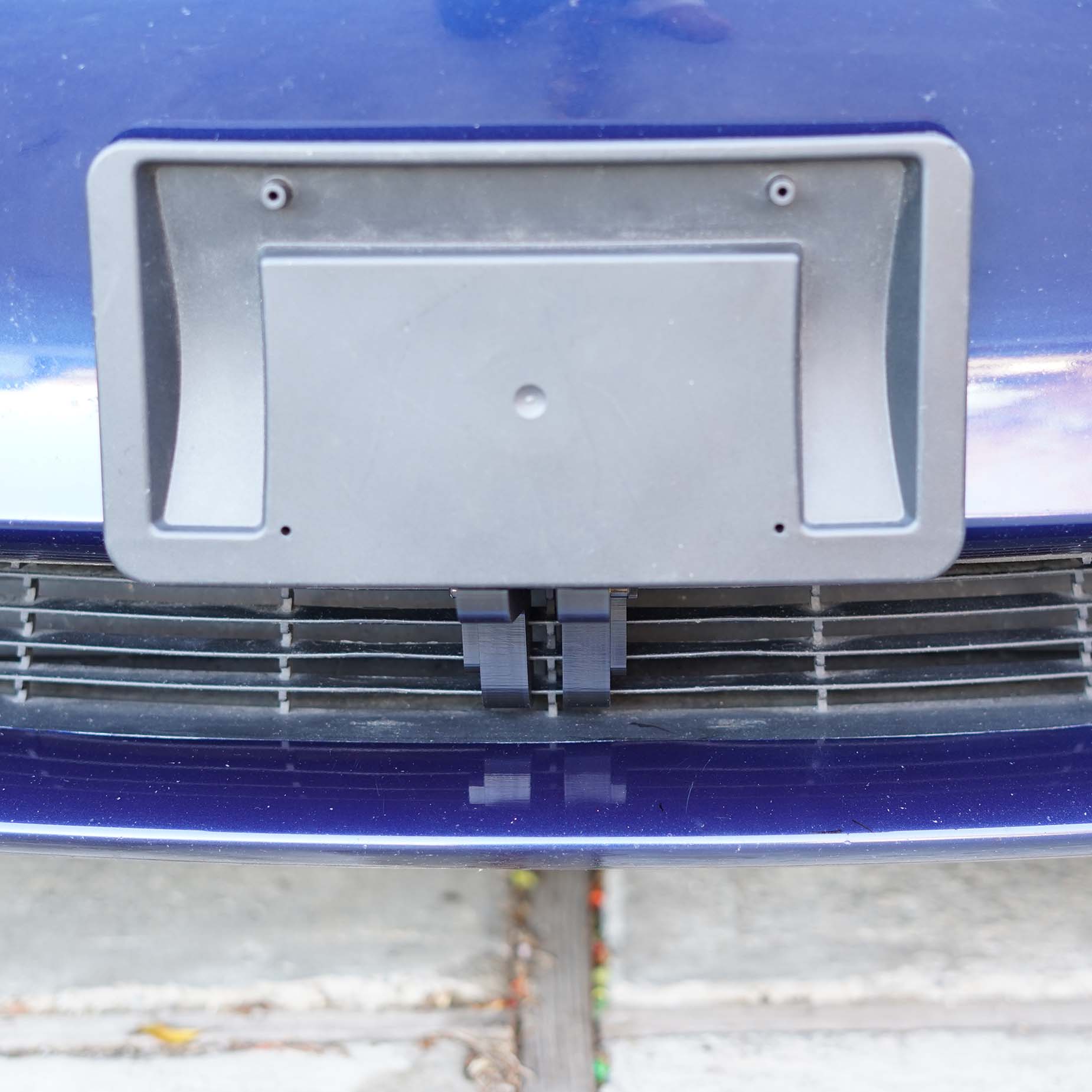 thumbnail interactive-video image 1 of No-Drill Front License Plate Holder For Tesla Model 3 (2017-2023) – Quick Release Bracket By STO N SHO 1 of 3